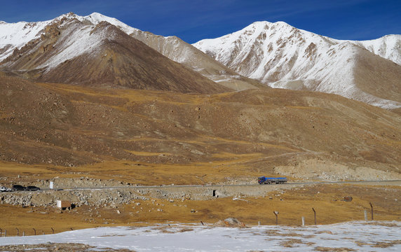 Truck and mountains at Khunjerab pass at china-pakistan border i