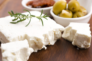 Feta cheese with olives, sun dried tomatoes and fresh herbs