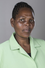 Portrait of a black middle aged woman making facial expressons