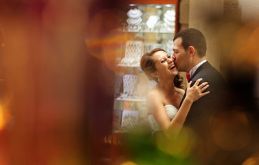 Bride and groom kissing on the streets