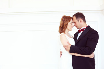 Bridal couple kissing lovely wedding day