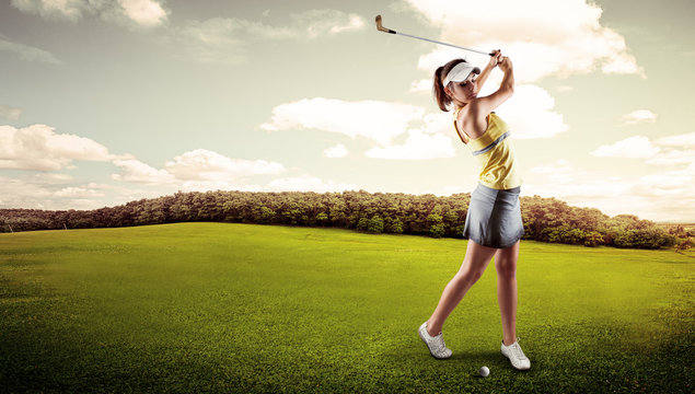 Active woman player hitting the ball on golf court