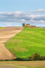 Fototapeta na wymiar Little Tuscan house on hill in summer colors