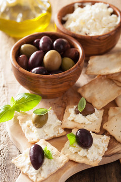 Crackers With Soft Cheese And Olives. Healthy Appetizer