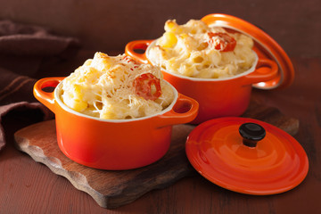 baked macaroni with cheese in orange casserole