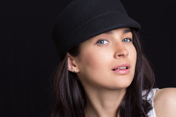 the attractive woman in a cap