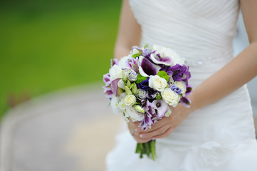 Beautiful wedding bouquet in hands of bride