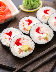 Sushi rolls with tobiko and shrimps