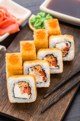 Fried sushi roll with salmon teriyaki