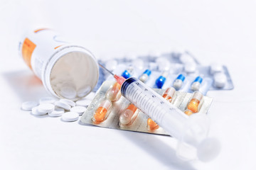 Syringe with glass vials and medications pills - 72928526