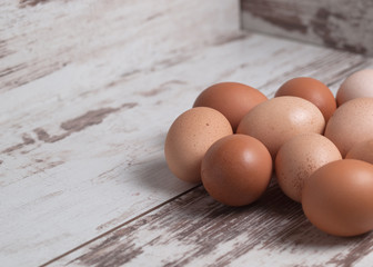 Many eggs over a wooden background
