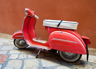 Vintage Vespa scooter on Kerkyra street on Corfu island. Greece.