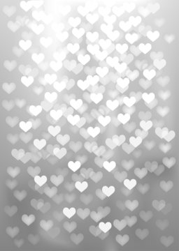 Silver festive lights in heart shape, vector background.