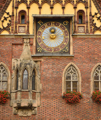 Old clock on the facade of the town hall in Wroclaw, Poland