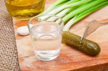 glass of vodka and a snack