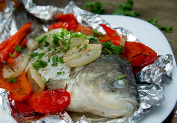 baked fish with bell peppers, onions and herbs