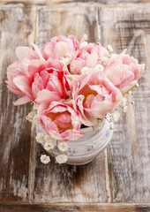 Romantic bouquet of pink tulips and gypsophilia paniculata