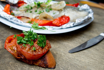 baked fish with bell peppers, onions and herbs