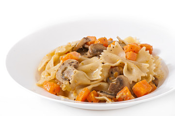 Pasta in cream sauce with slices of pumpkin and mushroom