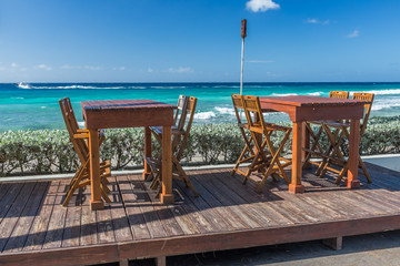 Beach front restaurant table and chairs in Barbados