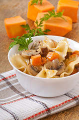 Pasta in cream sauce with slices of pumpkin and mushroom