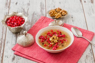 Turkish dessert Ashura, Noah's pudding, with pomegranate seeds and walnuts