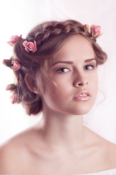 Beautiful Young model with floral delicate hairstyle
