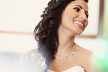Beautiful bride to be applying make up happy smile wedding