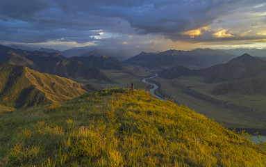 Lonely photographer on the mountain top. Altai, Russia