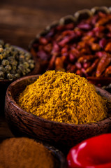 Wooden table of traditional Asian spices