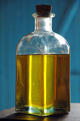 Yellow cameline oil in a bottle with cork