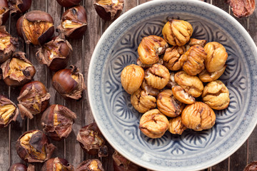 Peeled roasted sweet chestnuts in a bowl.