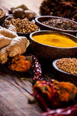 Oriental hot spices on wooden table