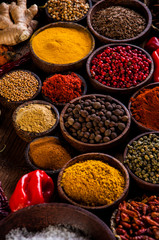 Oriental hot spices on wooden table