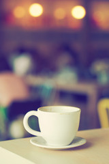cup of coffee in coffee shop vintage color tone