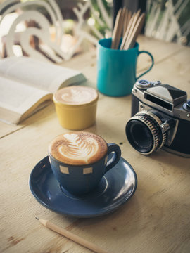 cup of coffee in coffee shop vintage color tone
