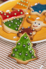 Christmas handmade cookies tree on wooden background