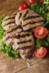 Grilled beef meatballs and vegetables on wooden bord