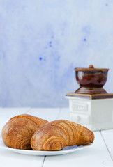 Two croissant on white plate