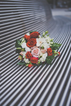 beautiful wedding bouquet on the iron bench