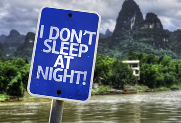 I Don't Sleep At Night sign with a exotic background