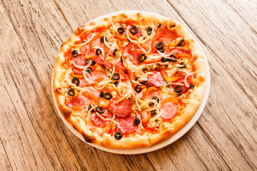 pizza on wooden background
