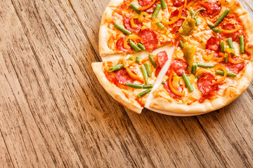 pizza on wooden background