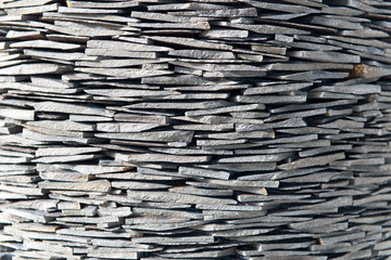 Stack of stone shingles in a drystone formation