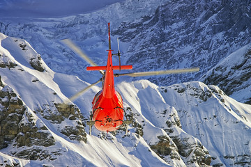 Red helicopter at swiss alps near Jungfrau mountain © Roman Babakin