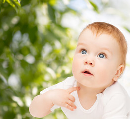 curious baby lying on floor and looking up