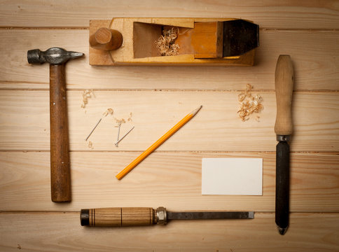 joinery tools on wood table background with business card