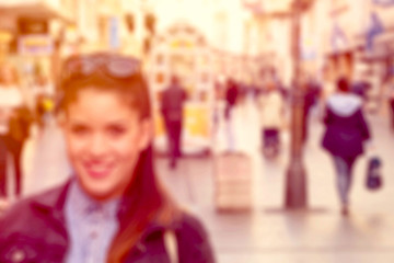 Blurred image of people in city