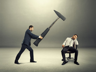 displeased boss holding big hammer © ArtFamily