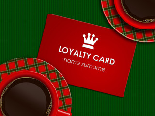 coffee with loyalty card lying on tablecloth